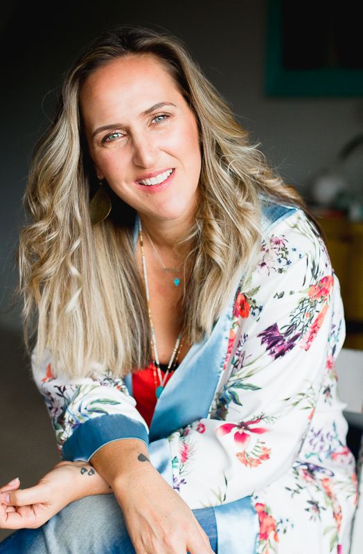 Siobhan Breslin, smiling, in a floral jacket